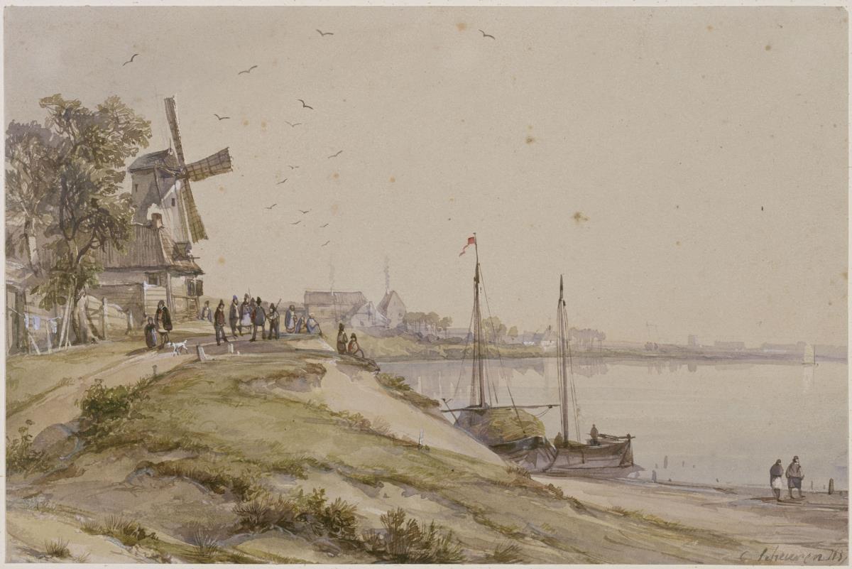 Windmühle und kleine Ortschaft an einer Bucht
