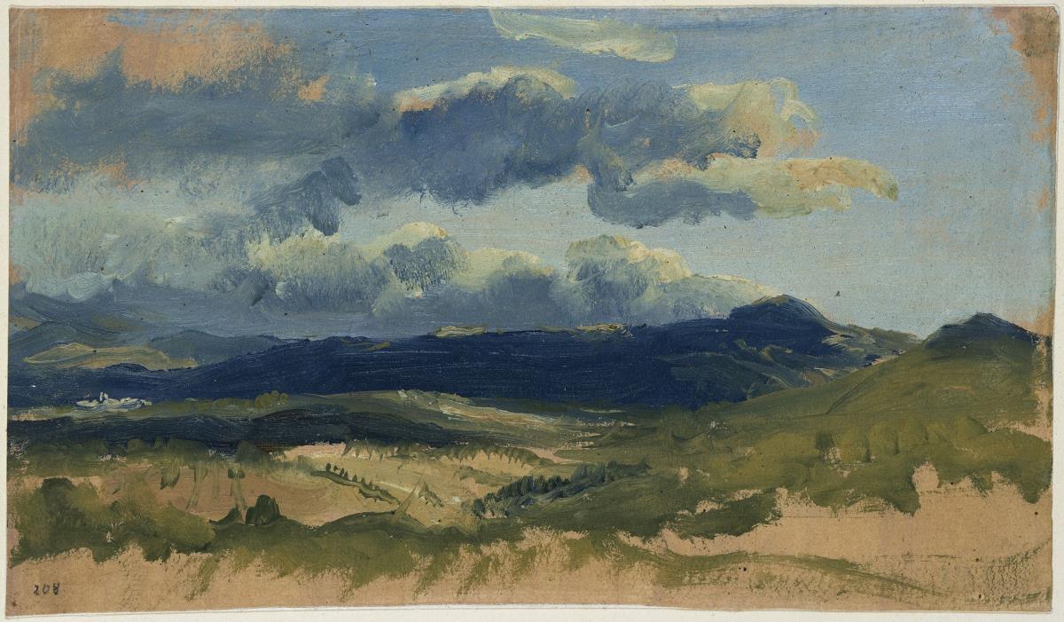 Hügelige Landschaft mit bewölktem Himmel