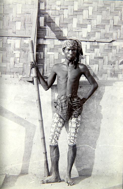 a tatooed man, done in Burma