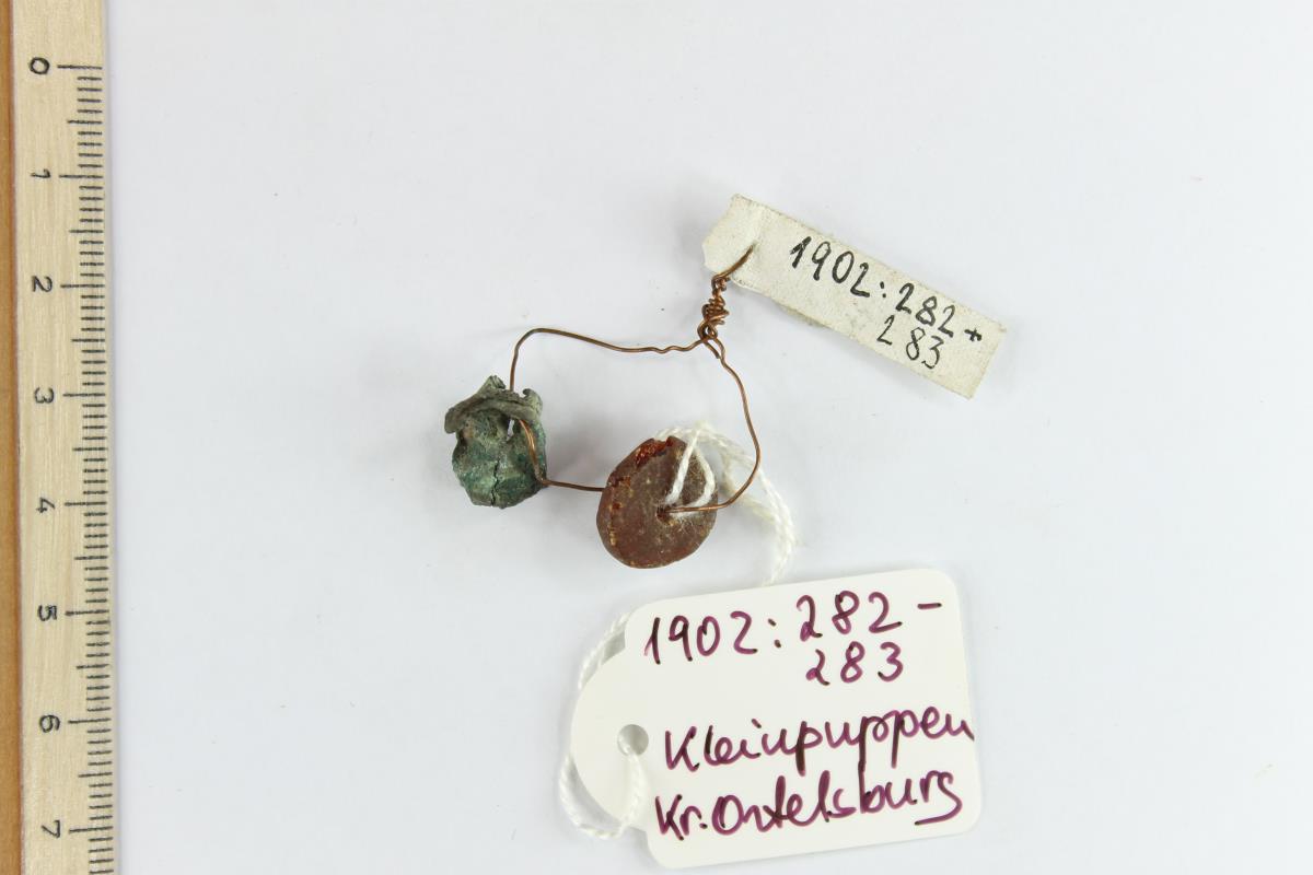 Bernsteinperle; Bronzerest