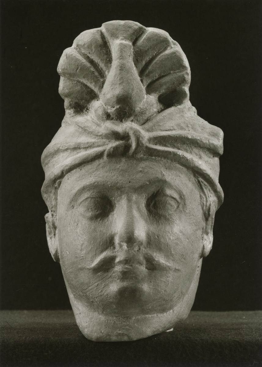Kopf eines Mannes mit Turban und Schnurrbart