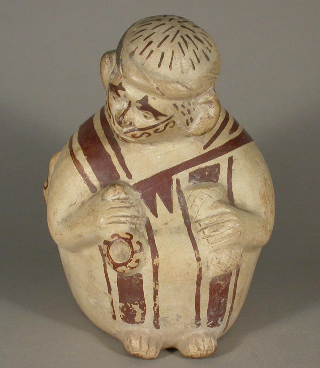 Sitzende anthropomorphe Figurr mit "Dipper" und Matte