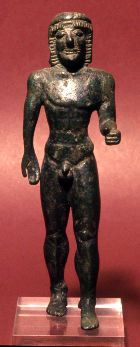 Archaische Votivstatuette eines schreitenden nackten Jünglings