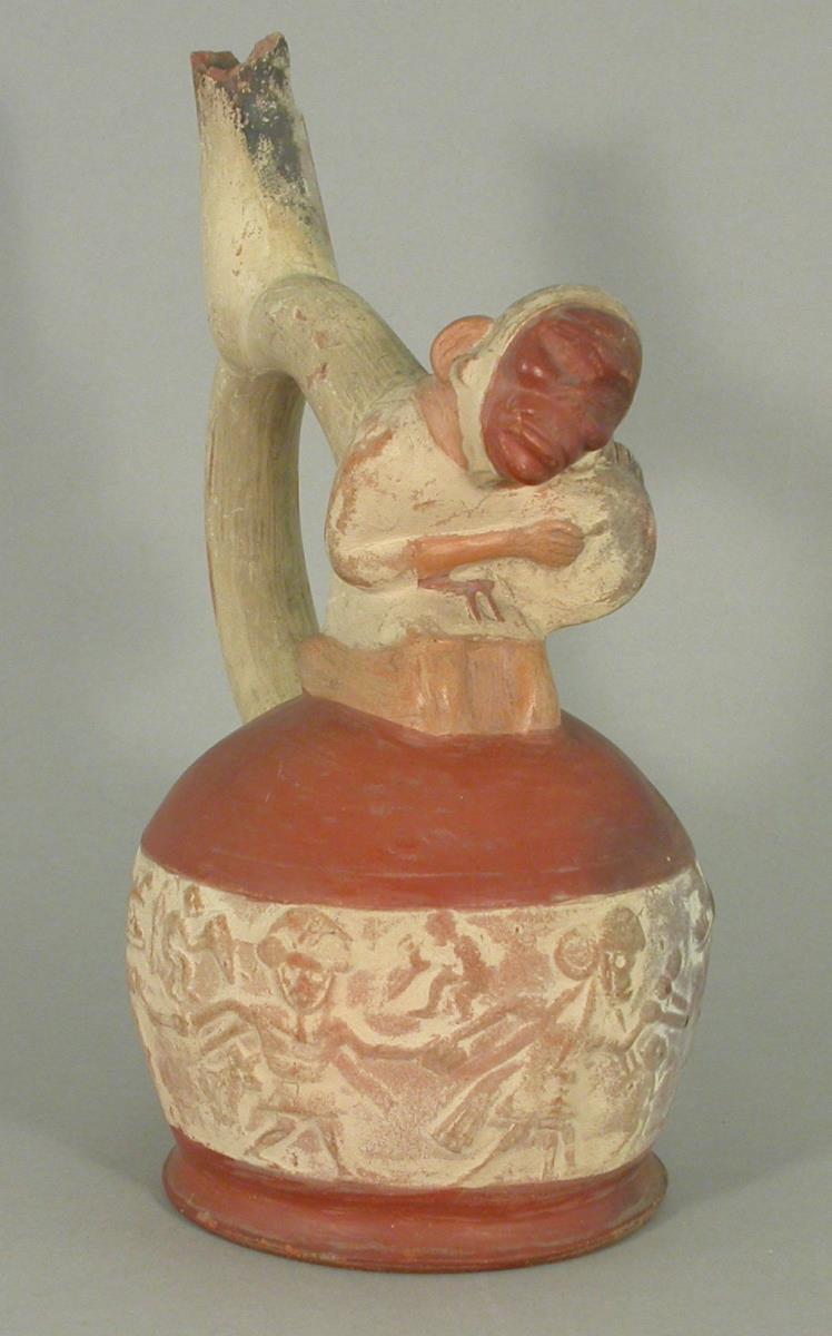 Applikation: anthropomorphe Figur mit Trommel, blind; Relief: