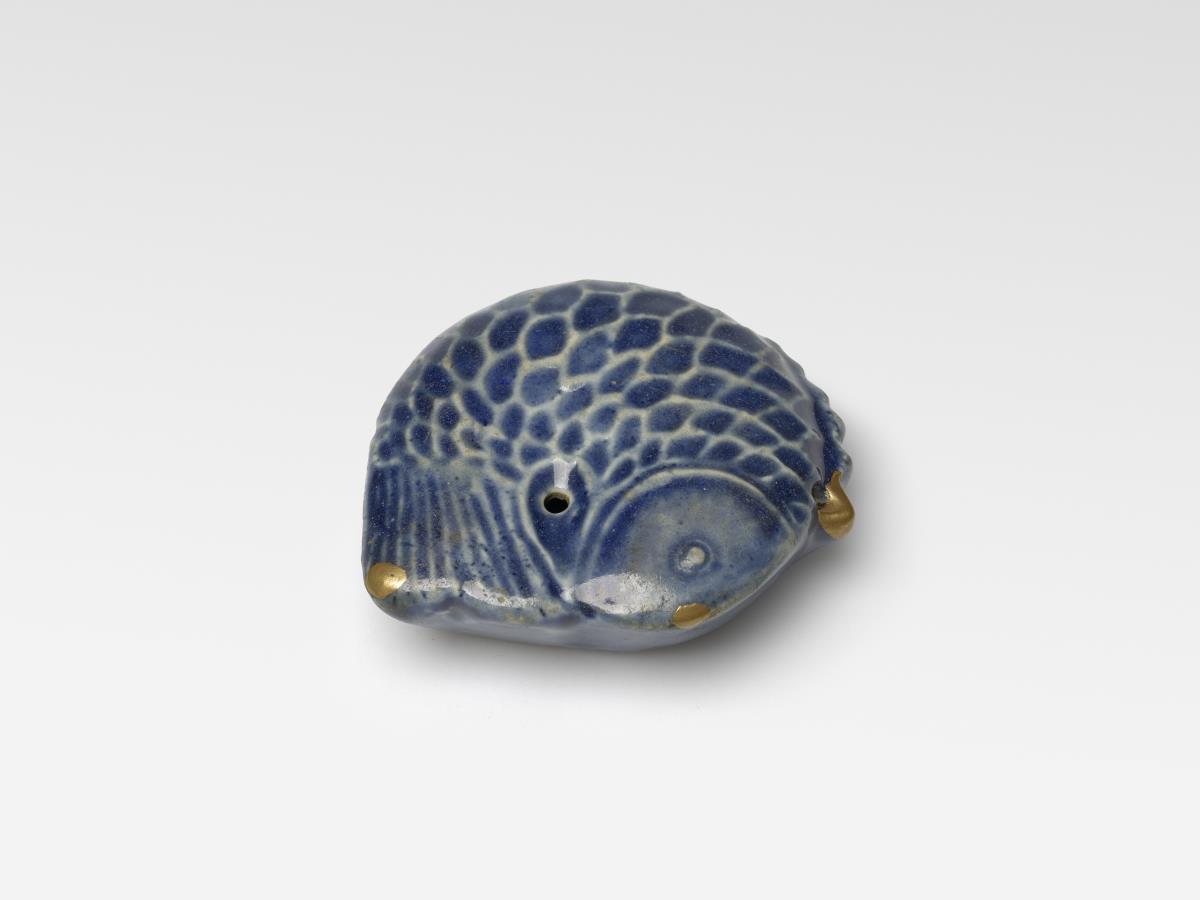 Wassertropfer in Form eines Fisches