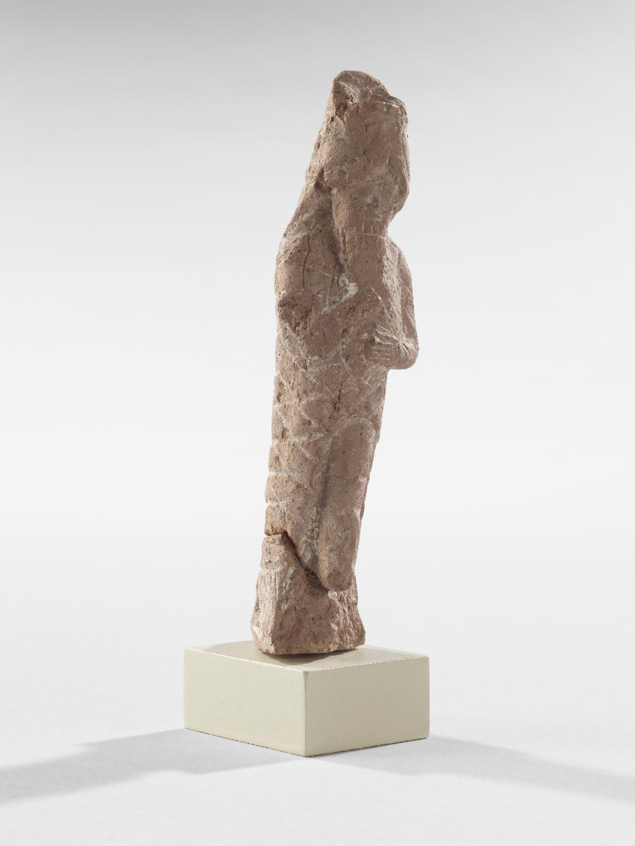 Statuette eines Mannes im Fisch-Gewand