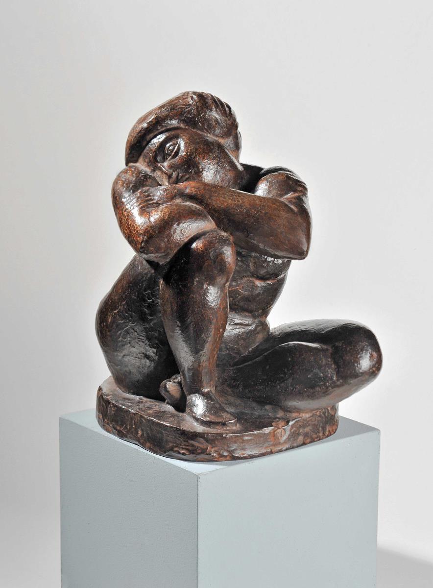 Hockende Frau