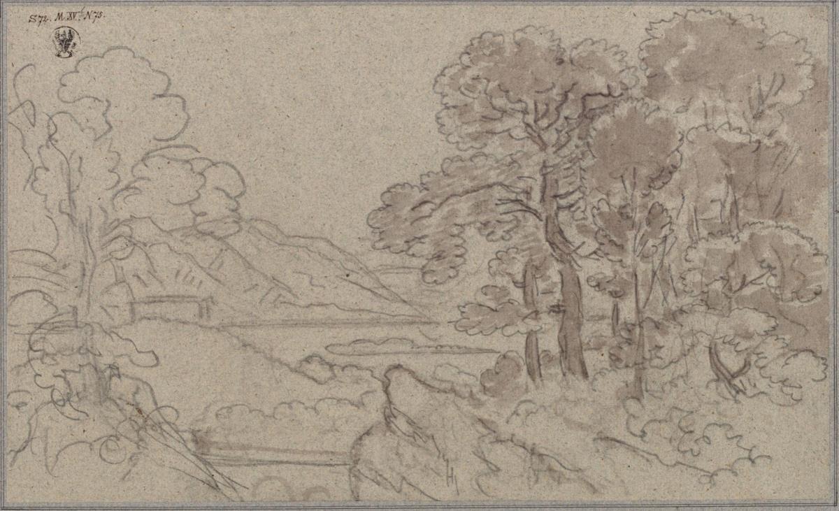 Ein See im Gebirge mit Baumgruppen am Ufer