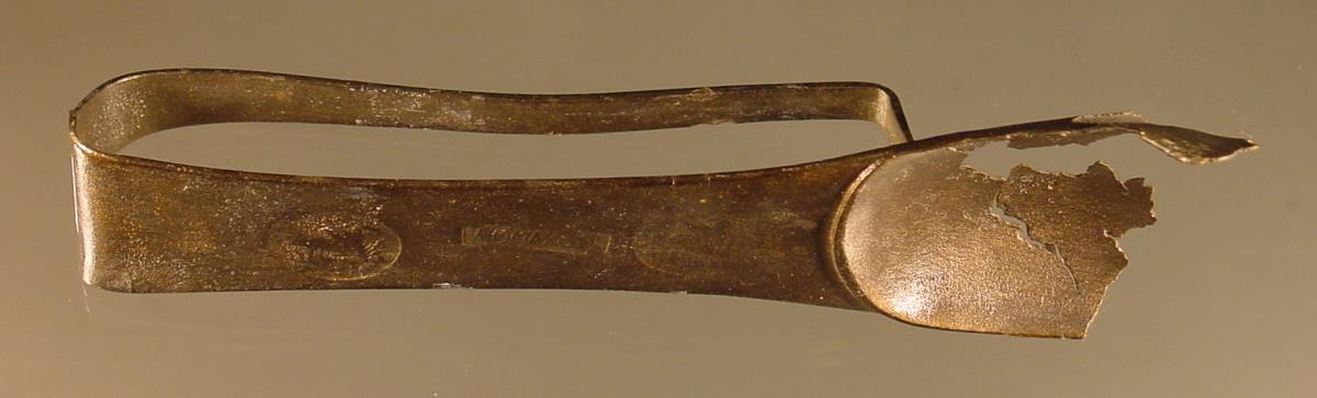 Strigilis mit griechischem Fabrikstempel "PA(L)YMMACHO(R)U ?"