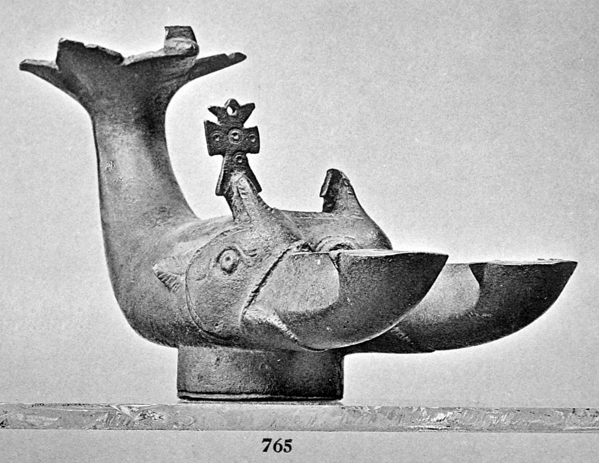 Lampe in Form eines Delphins mit zwei Flammen