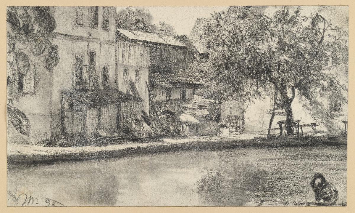 Rückseite einer Häuserreihe und Baum am Wasser