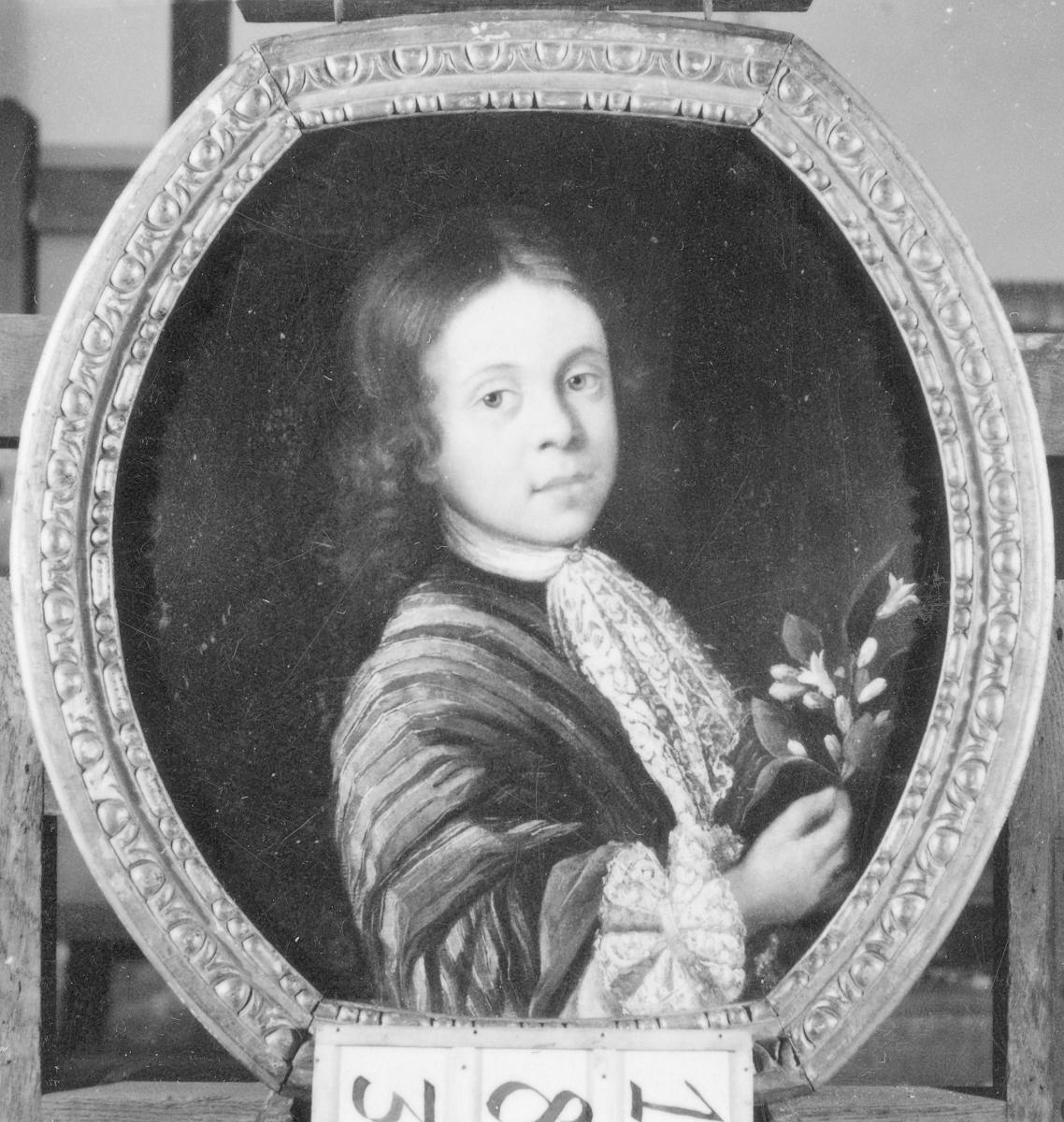 Porträt eines Kindes mit Spitzenbinde und Blume in der Hand