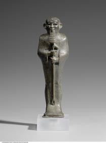 Statuette des mumiengestaltigen Gottes Ptah mit einem Was-Zepter, mit ehemals eingelegten Augen