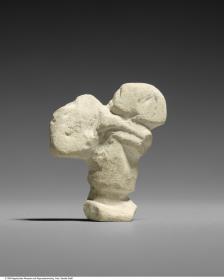 Statuette eines Menschen mit großem Last auf dem Rücken