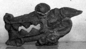 Zierstück mit Kopf